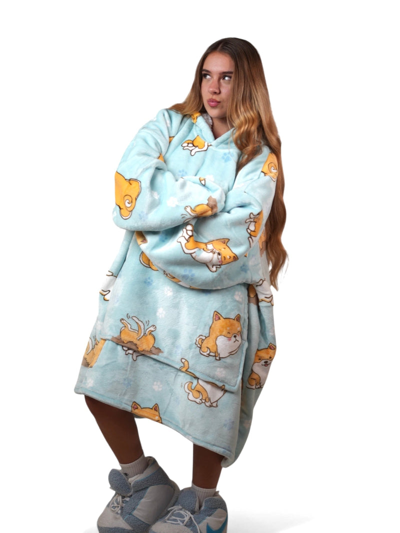 Light blue sherpa-lined oversized wearable blanket hoodie featuring a cute dog print, displayed on a plain white background.