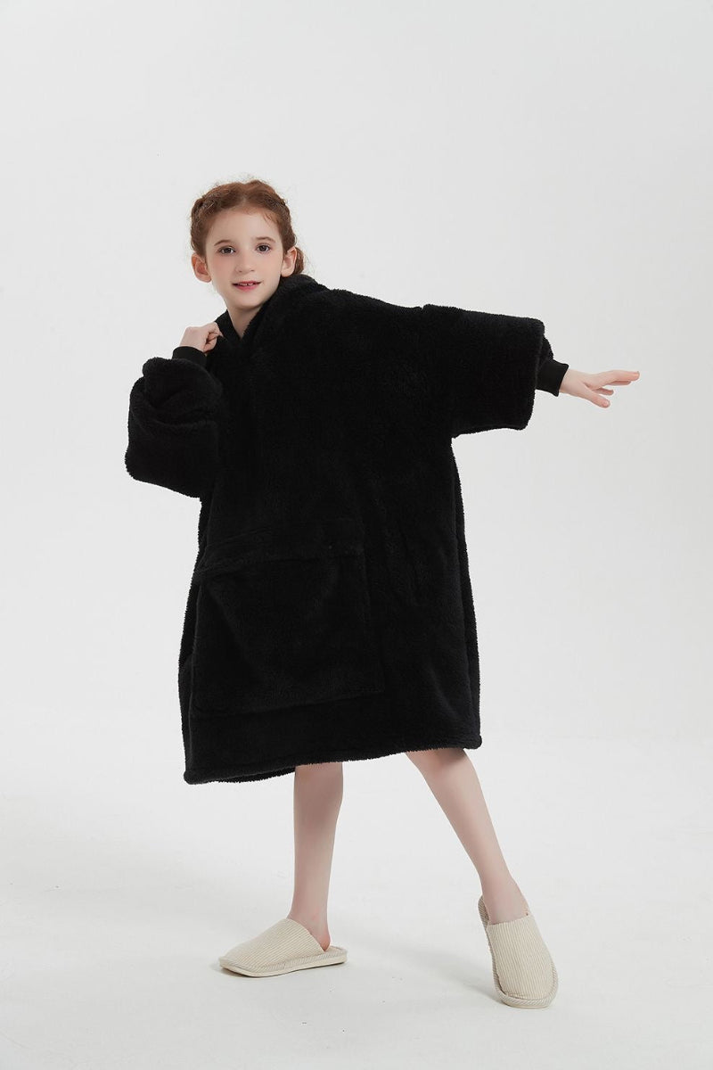Black oversized wearable blanket hoodie for girls, featuring sherpa fleece lining, large front pocket and hood – cozy winter loungewear ideal for home comfort and gifting in Lebanon