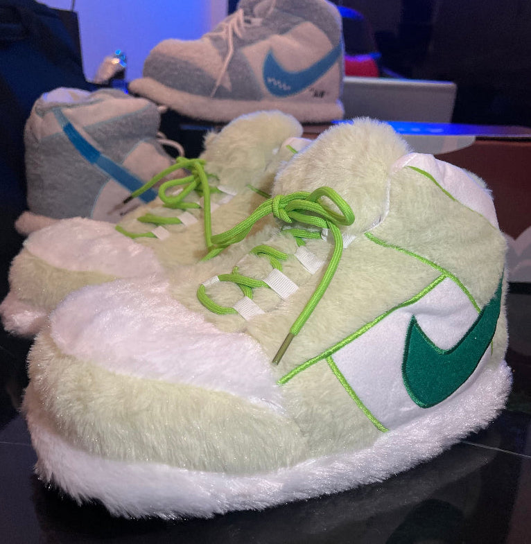 Green and white plush sneaker‑style cozy slippers with soft fuzzy lining – warm indoor loungewear footwear for men, women and teens, ideal winter comfort and home cozy shoes in Lebanon