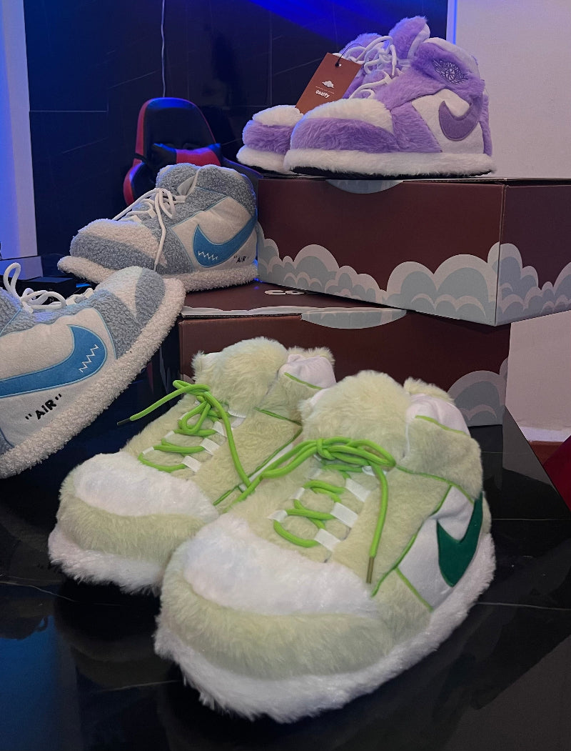 Plush sneaker‑style cozy slippers in green, grey and purple with soft fuzzy lining – comfortable indoor winter loungewear footwear for men, women and teens, ideal for home comfort and gifting in Lebanon