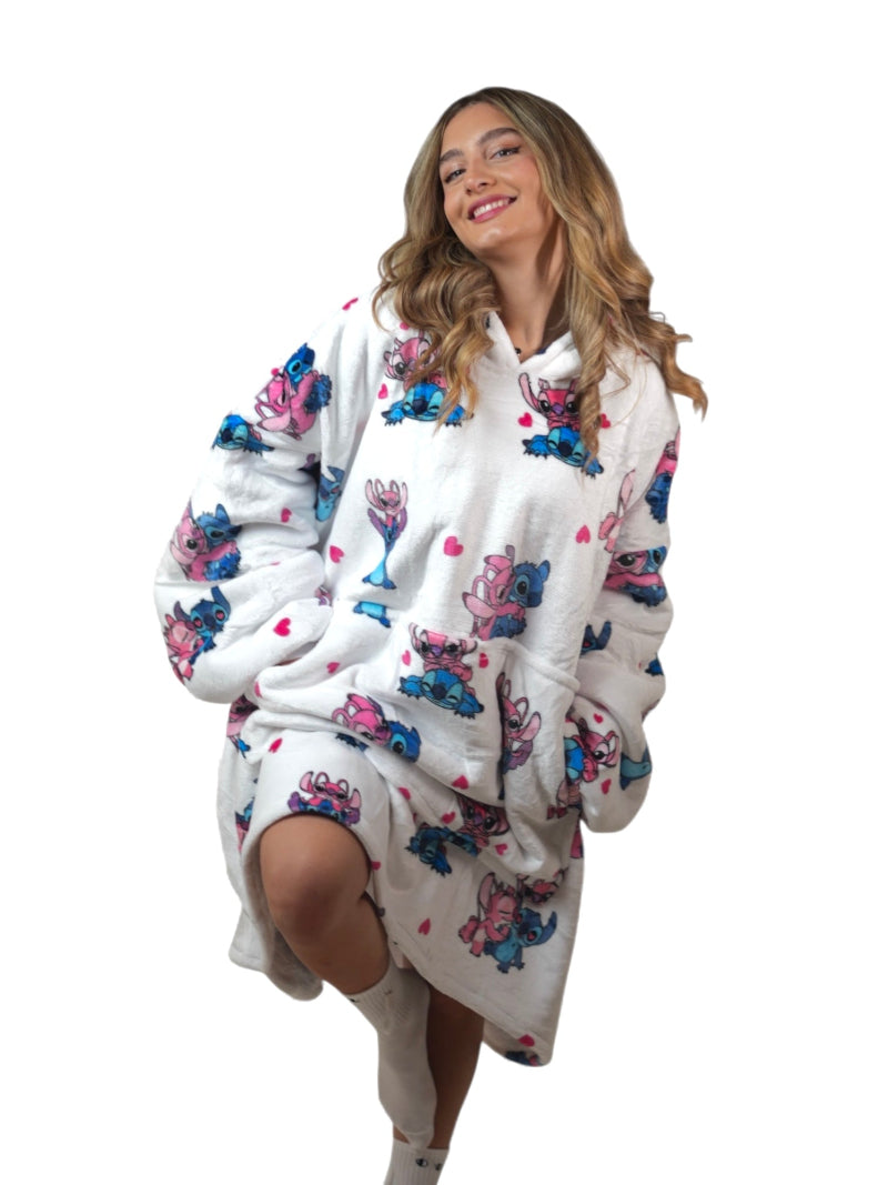 Woman wearing a white oversized wearable blanket hoodie with Stitch and Angel cartoon print, sherpa fleece lining and front pocket – cozy Disney-inspired loungewear for women and teens, perfect for winter comfort and gifting in Lebanon