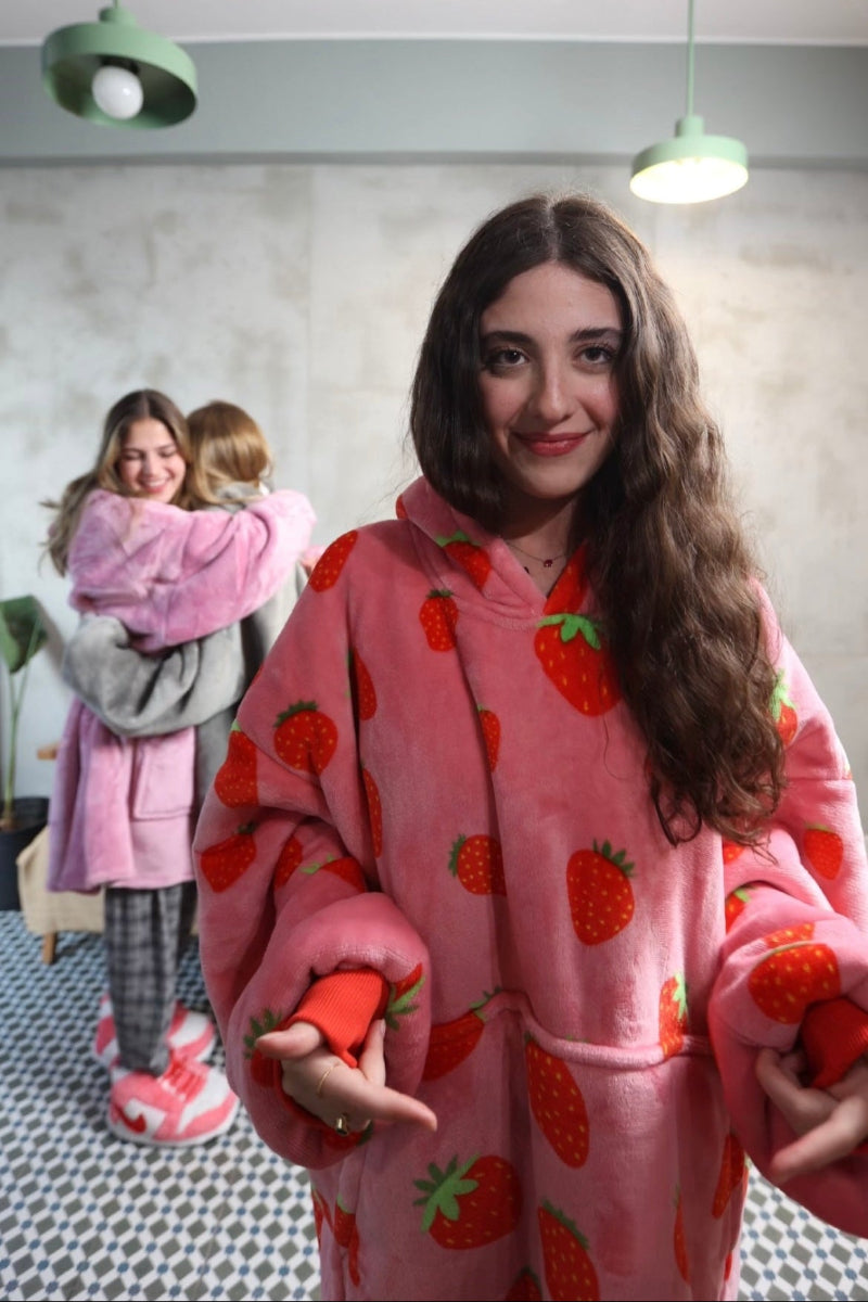 Oversized wearable blanket hoodie with cute red strawberry print on soft fleece, featuring sherpa lining, large front pocket and cozy hood – perfect winter loungewear for women, teens and gifting in Lebanon